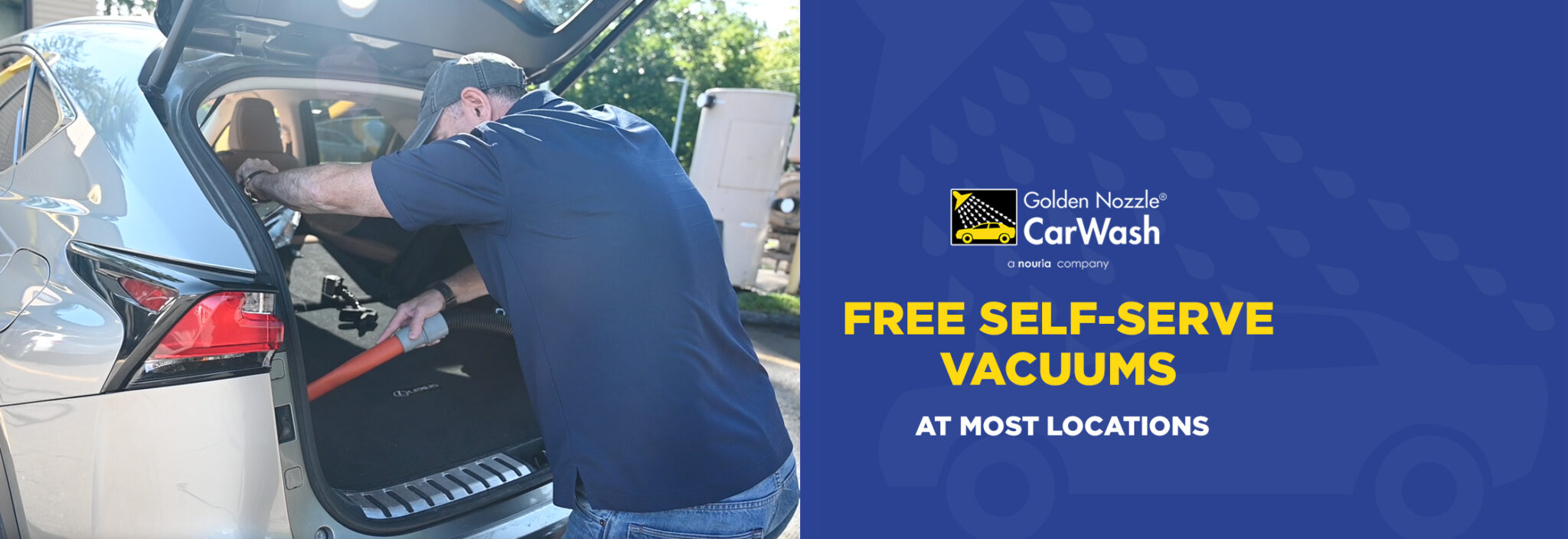 A man uses a vacuum to clean the trunk of an SUV at a car wash near me. Beside him, a blue banner with the Golden Nozzle Car Wash logo reads: FREE SELF-SERVE VACUUMS AT MOST LOCATIONS.